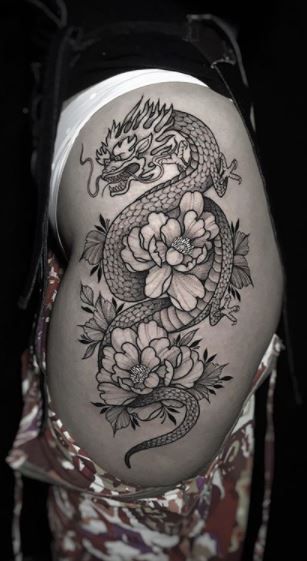 Tatouage sur la cuisse dragon